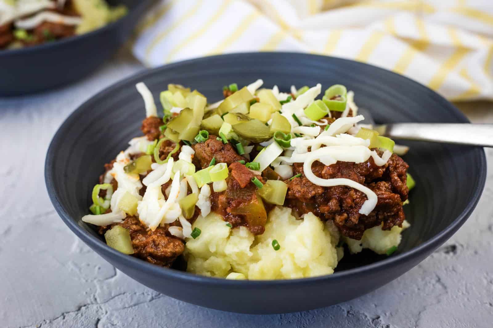 A black bowl of Sloppy Joe Mashed Potato.